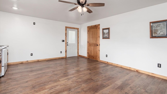 spare room featuring a ceiling fan, baseboards, and wood finished floors