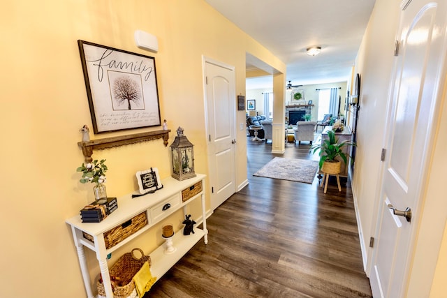 corridor with dark wood finished floors