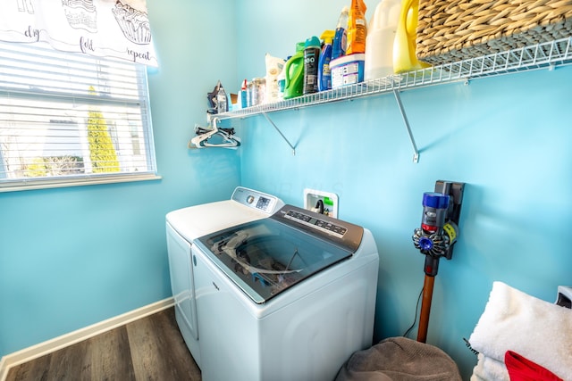 laundry room with baseboards, dark wood-style flooring, laundry area, and washing machine and clothes dryer