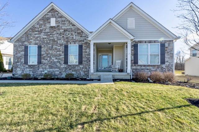 view of front of house featuring covered porch and a front lawn