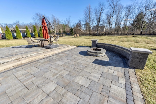 view of patio / terrace featuring a fire pit