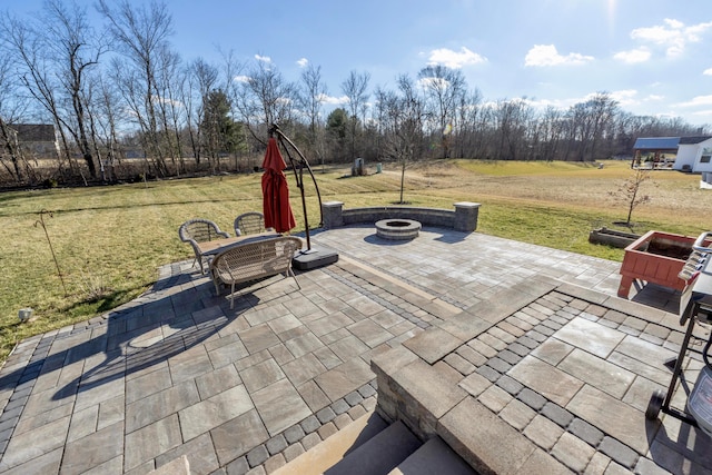 view of patio with a fire pit