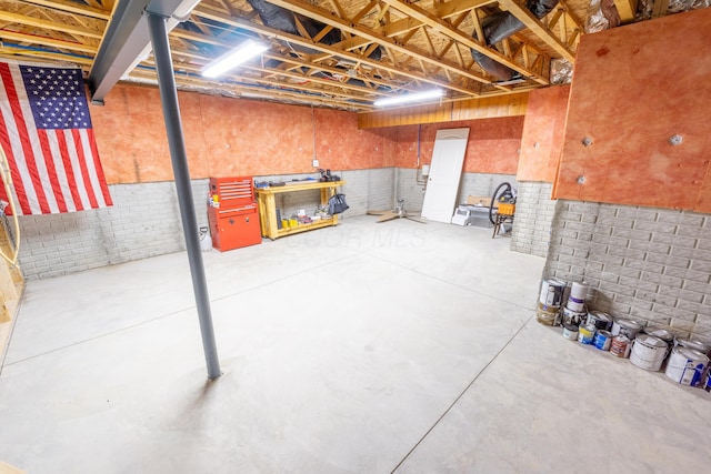 basement with brick wall