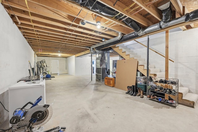 unfinished basement featuring stairs