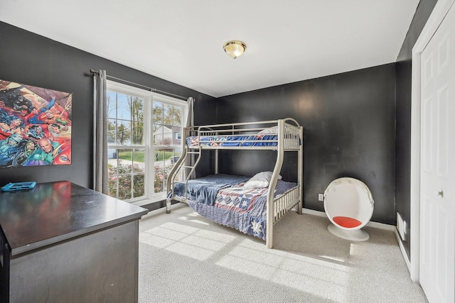 bedroom featuring baseboards and carpet flooring