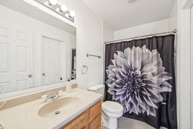 bathroom with toilet, a shower with shower curtain, and vanity