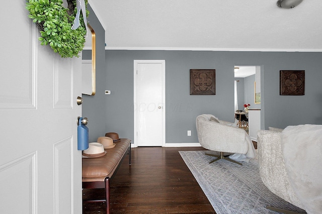 interior space with baseboards and wood finished floors