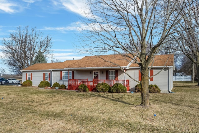 single story home with a front yard and covered porch