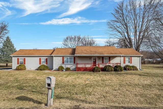 single story home with a porch and a front lawn