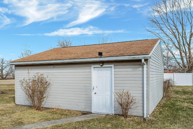 view of outbuilding with an outdoor structure and fence