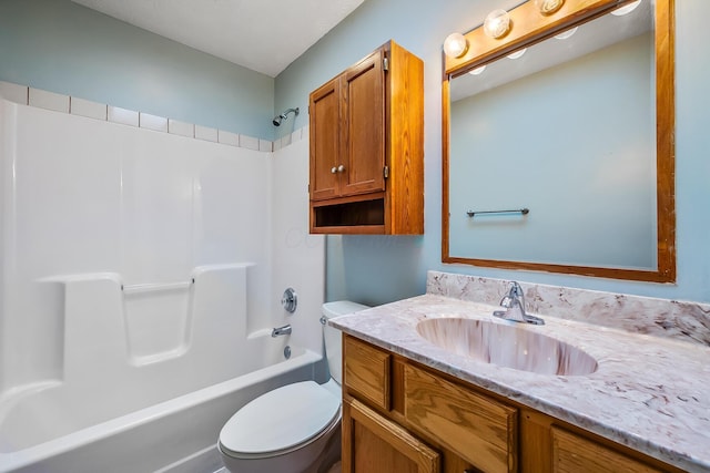 full bathroom featuring shower / bathing tub combination, vanity, and toilet