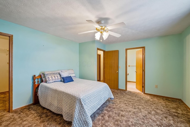 carpeted bedroom with a textured ceiling, a ceiling fan, and baseboards