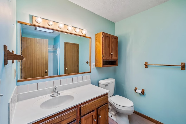 bathroom featuring baseboards, toilet, an enclosed shower, a textured ceiling, and vanity