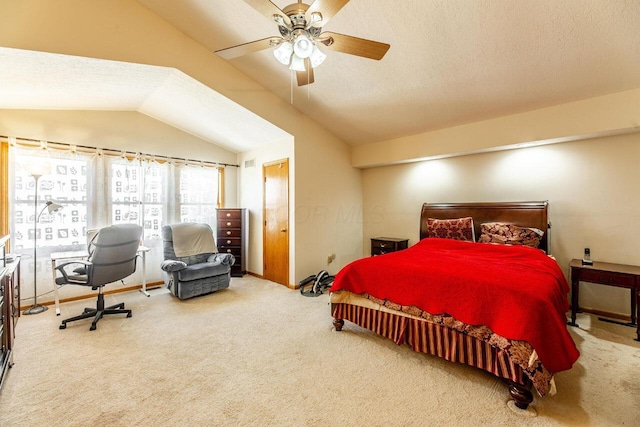 carpeted bedroom featuring lofted ceiling, a ceiling fan, and a textured ceiling