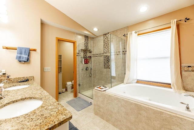 full bath featuring a garden tub, lofted ceiling, a sink, and a stall shower