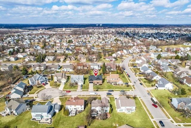 birds eye view of property with a residential view