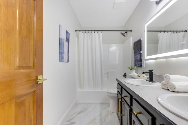 bathroom featuring baseboards, shower / bath combo with shower curtain, double vanity, marble finish floor, and a sink