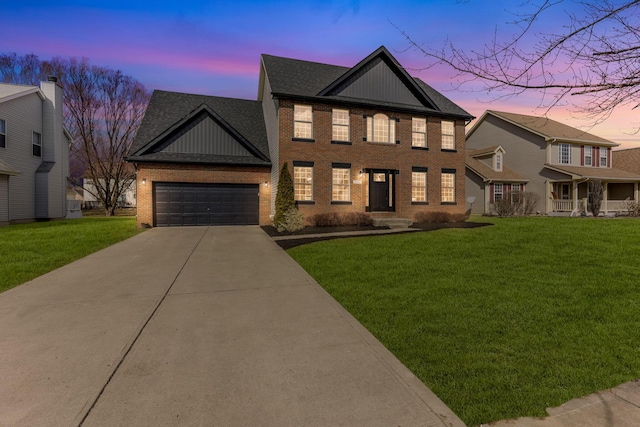 view of front of home featuring board and batten siding, a yard, brick siding, and driveway