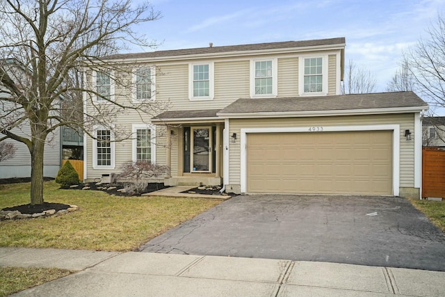 view of front of home with a front lawn and driveway