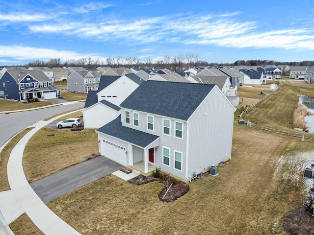 birds eye view of property with a residential view