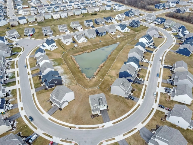 birds eye view of property featuring a residential view and a water view