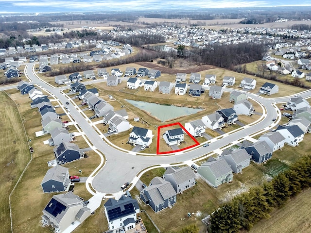 birds eye view of property with a residential view