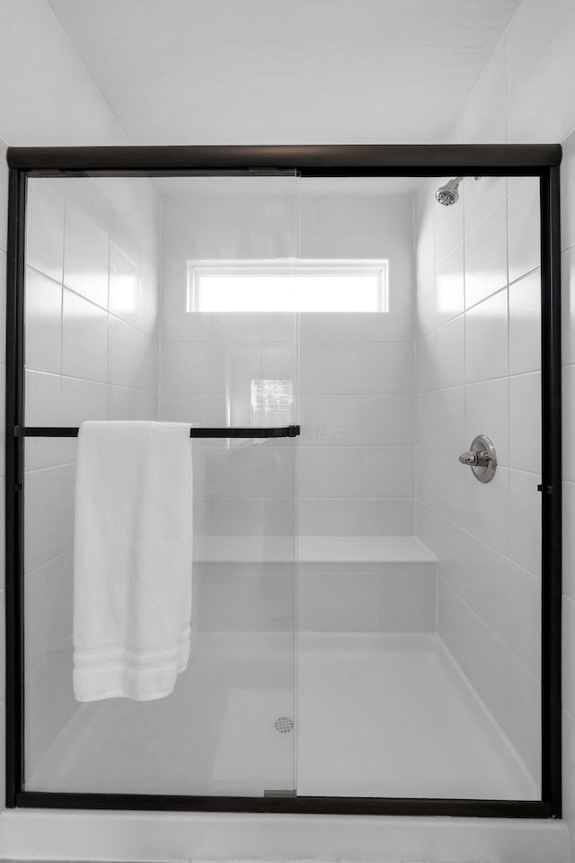 bathroom featuring a shower stall