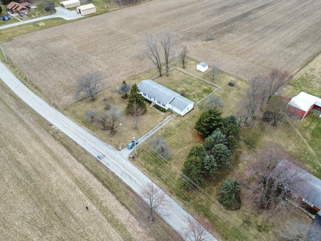 birds eye view of property with a rural view