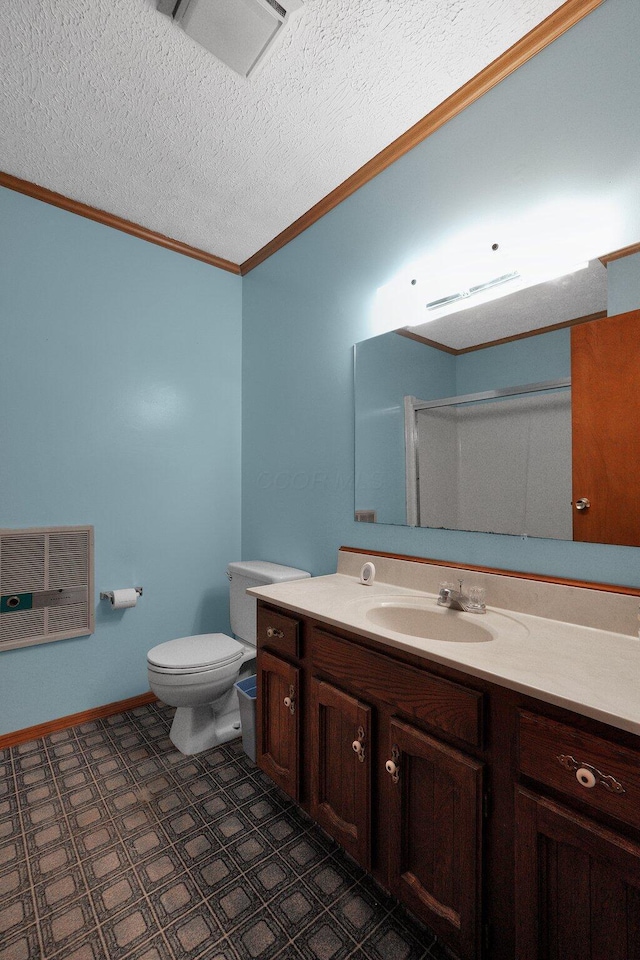 bathroom featuring heating unit, toilet, ornamental molding, a textured ceiling, and vanity