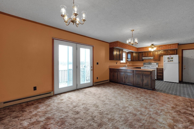 kitchen with ornamental molding, freestanding refrigerator, dark colored carpet, and an inviting chandelier