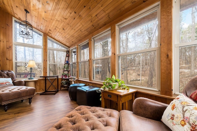 sunroom / solarium featuring wood ceiling, an inviting chandelier, and vaulted ceiling