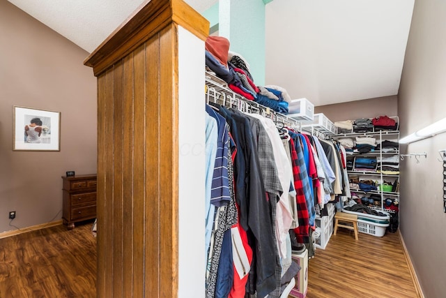 spacious closet with wood finished floors