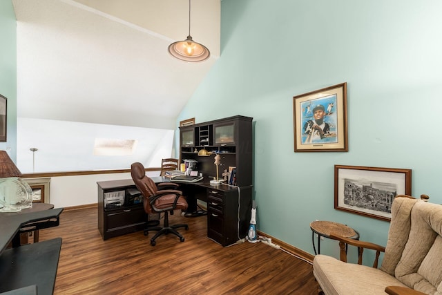 office featuring baseboards, high vaulted ceiling, and dark wood-style floors