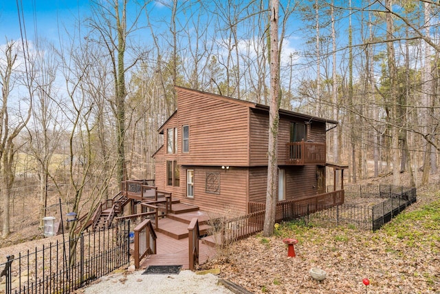 exterior space featuring a deck and fence