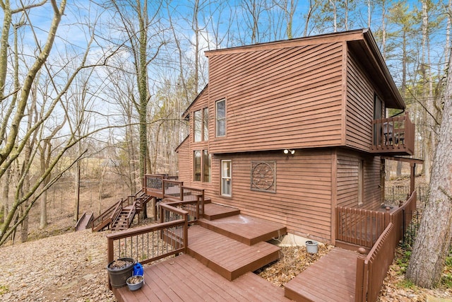 view of side of home featuring a wooden deck