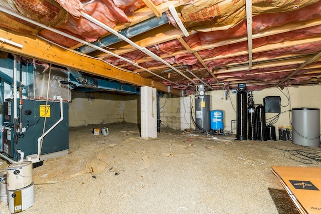 unfinished below grade area with heating unit and electric water heater