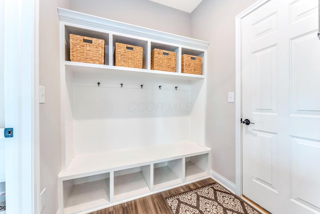 mudroom with baseboards and dark wood-style flooring