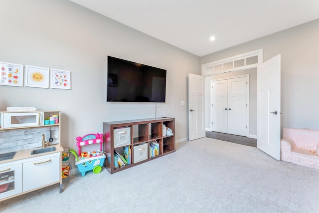 playroom featuring recessed lighting and carpet flooring