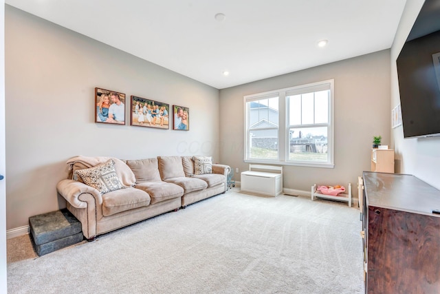 living area featuring recessed lighting, baseboards, and carpet floors