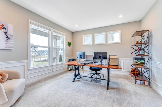 carpeted office with a wealth of natural light and wainscoting