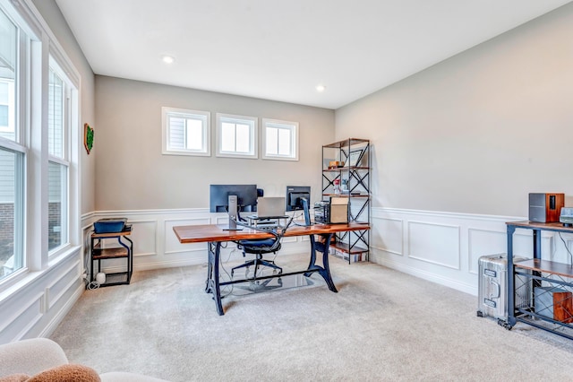 office space featuring recessed lighting, carpet flooring, and a decorative wall