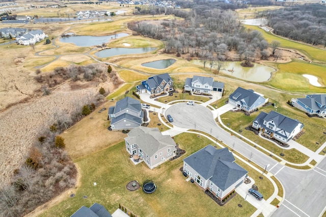 birds eye view of property featuring a residential view, a water view, and view of golf course