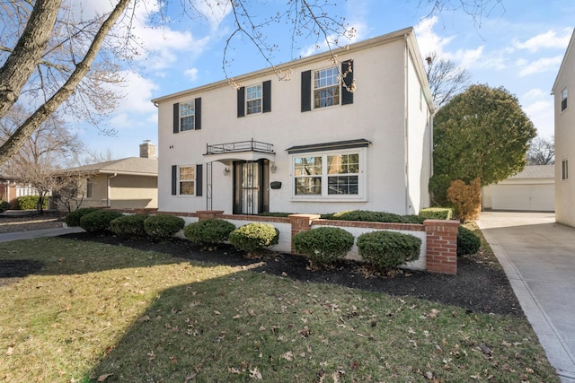 view of front of home featuring stucco siding and a front lawn