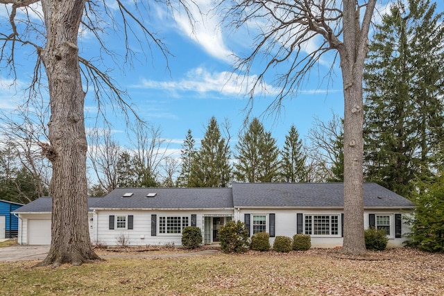 single story home with a garage