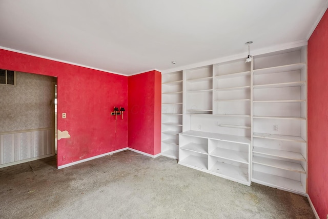 unfurnished bedroom featuring visible vents, baseboards, and carpet