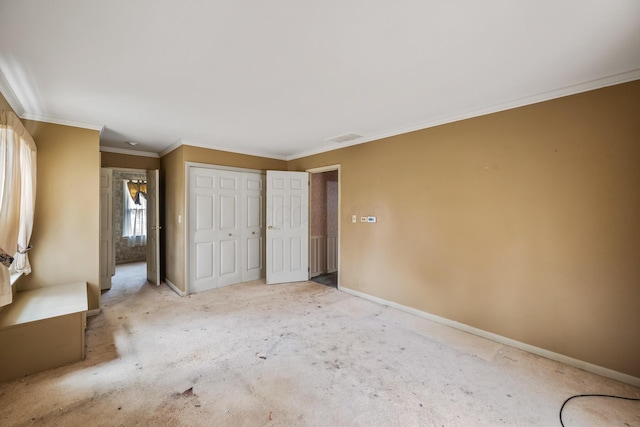 unfurnished bedroom with a closet, baseboards, carpet floors, and visible vents