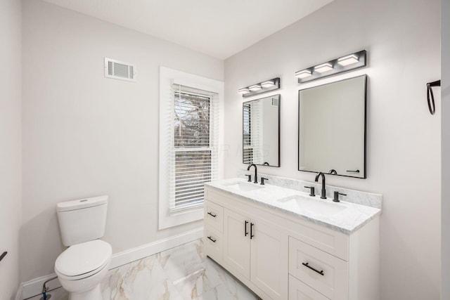 bathroom featuring visible vents, marble finish floor, toilet, and a sink