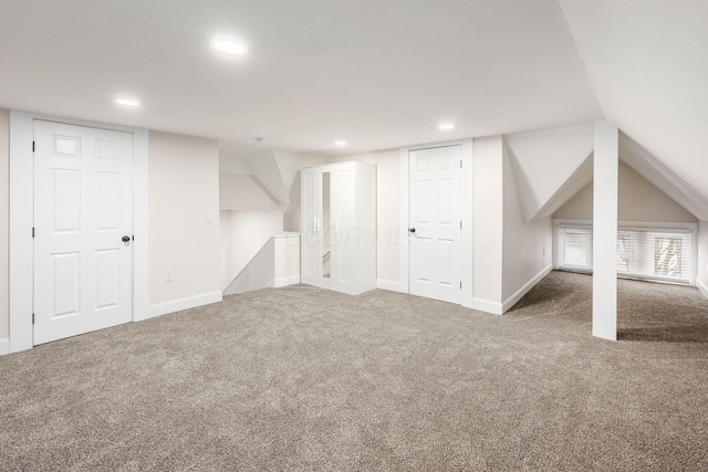 additional living space with carpet flooring, recessed lighting, and baseboards