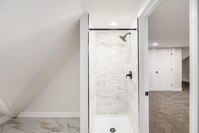 full bathroom with baseboards and a shower stall