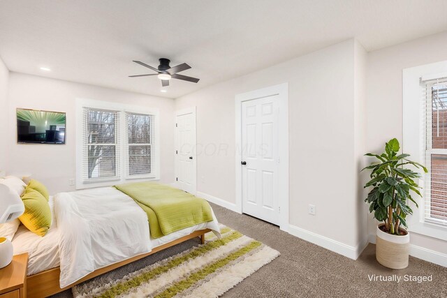 carpeted bedroom with multiple closets, recessed lighting, baseboards, and ceiling fan